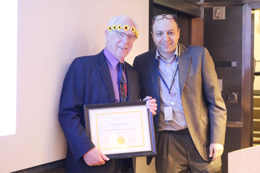 Elad Ziv, MD, (right) member of the Committee on Research presents Stroud with his FRL in basic science award certificate.